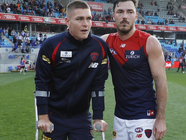 Michael Hibberd consoles injured teammate Adam Tomlinson.