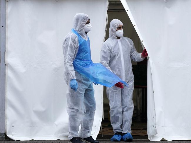 BIRMINGHAM, ENGLAND - APRIL 18: Specially trained volunteers work at a temporary mortuary erected in the car park of Central Jamia Mosque Ghamkol Sharif on April 18, 2020 in Birmingham, England. In a press conference on Thursday, First Secretary of State Dominic Raab announced that the lockdown will remain in place for at least 3 more weeks. The Coronavirus (COVID-19) pandemic has spread to many countries across the world, claiming over 140,000 lives and infecting more than 2 million people. (Photo by Christopher Furlong/Getty Images)