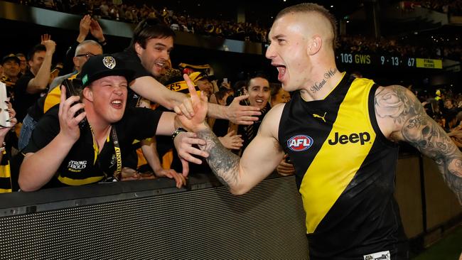 Dustin Martin celebrates Richmond’s preliminary final win with the fans.