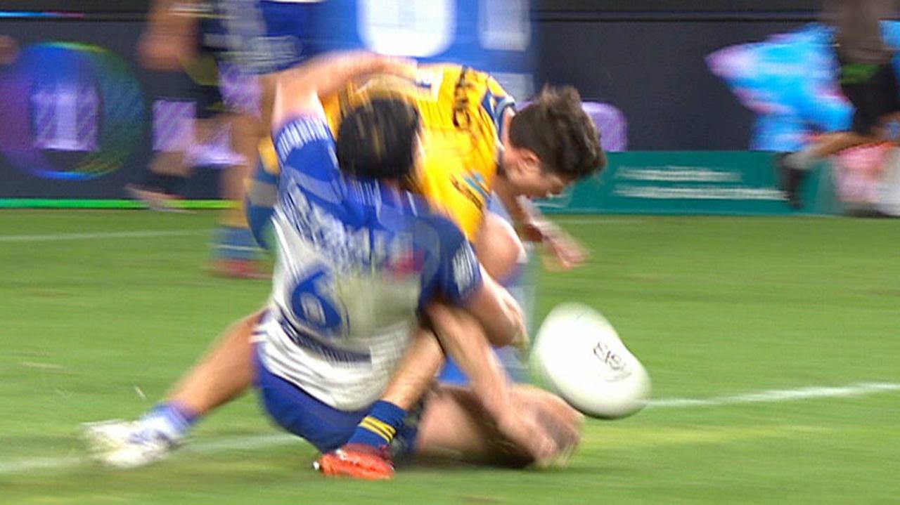 Mitch Moses is tackled by Matt Burton