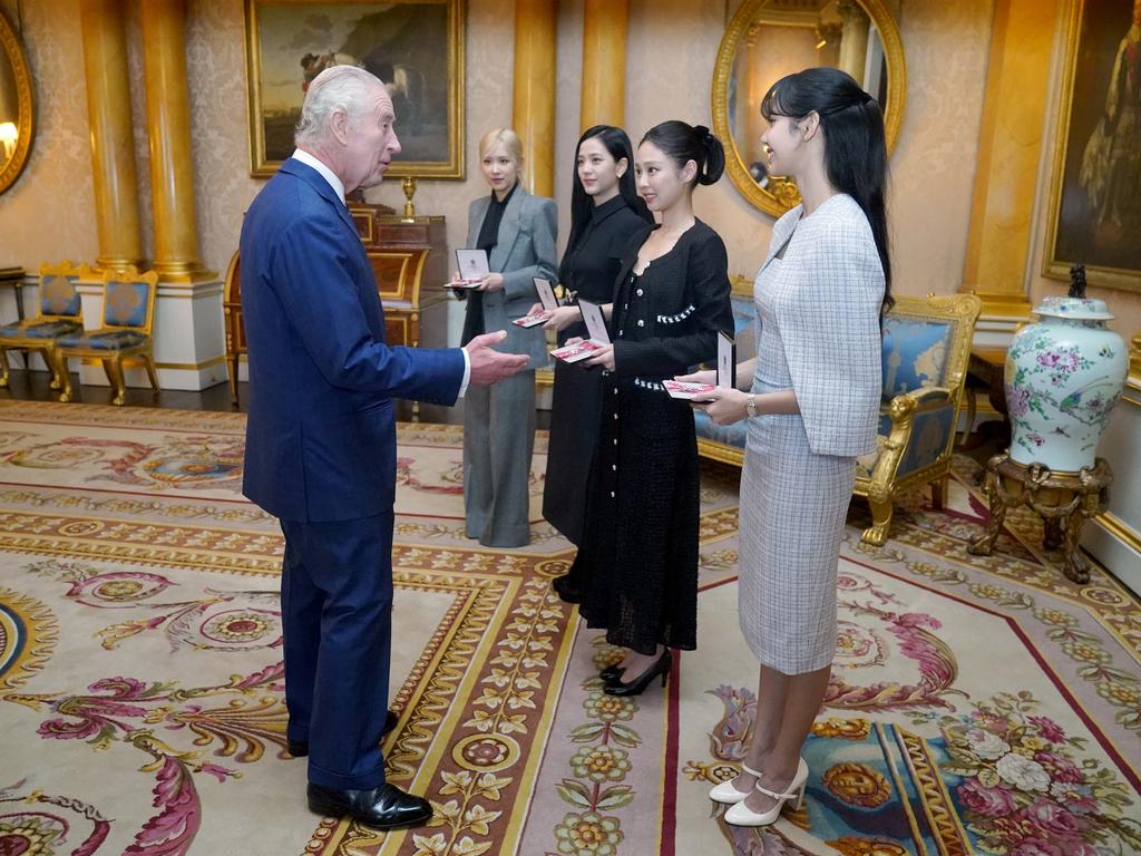 King Charles III presents the members of the K-Pop band Blackpink with Honorary MBEs during a special investiture ceremony at Buckingham Palace. Picture: Victoria Jones/Getty Images