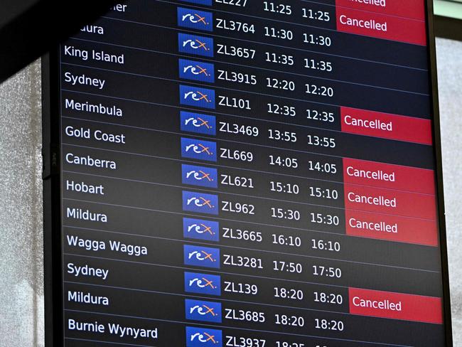 A screen shows cancelled Rex Airlines flights at Melbourne's Tullamarine Airport on Wednesday. Picture: AFP