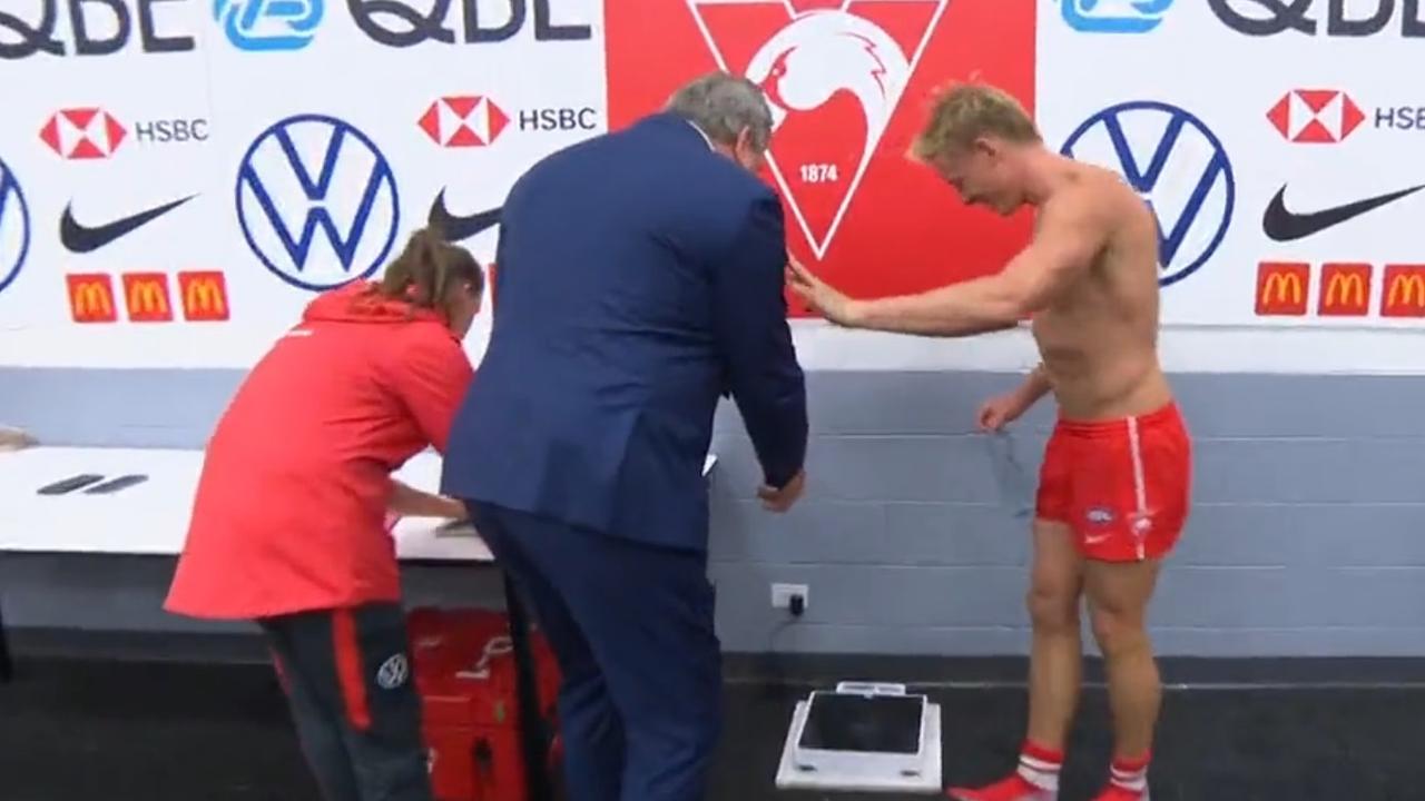 Isaac Heeney steps on the scales for Roaming Brian. Photo: Channel 7.