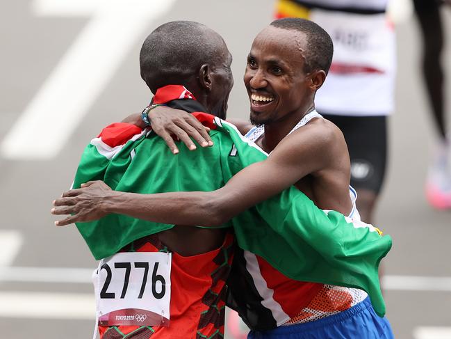 Kipchoge and Nageeye embrace at the finish line.