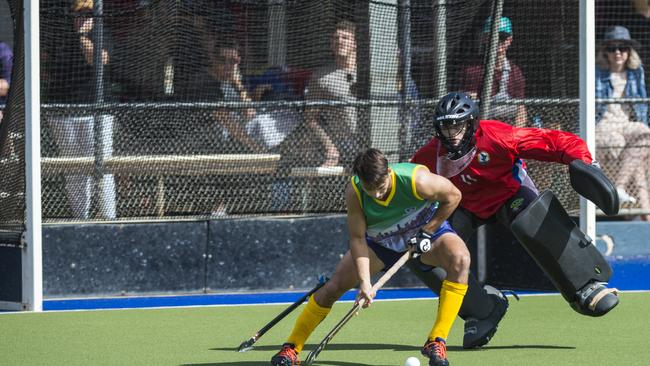 Brisbane player Joel Rintala against Toowoomba 1 keeper Tom Lebsanft. Picture: Kevin Farmer