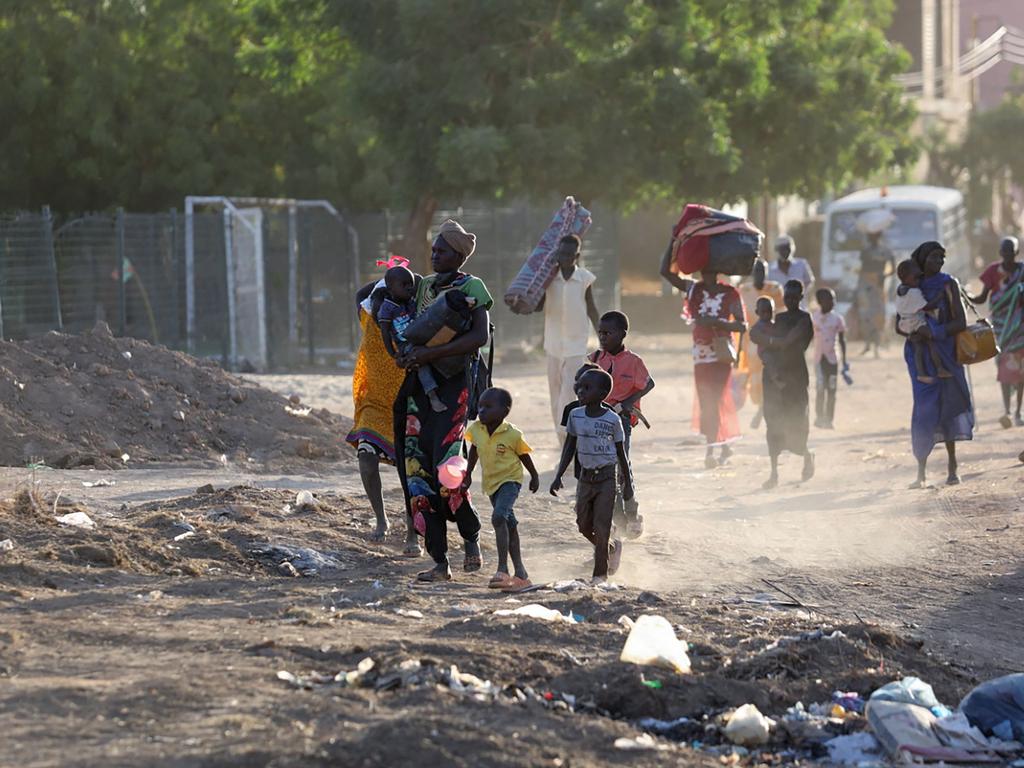 People flee their neighbourhoods amid fighting between the army and paramilitaries.