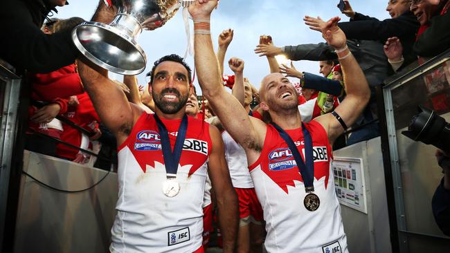 Adam Goodes celebrates the 2012 premiership win with Jarrad McVeigh. Picture: Phil Hillyard