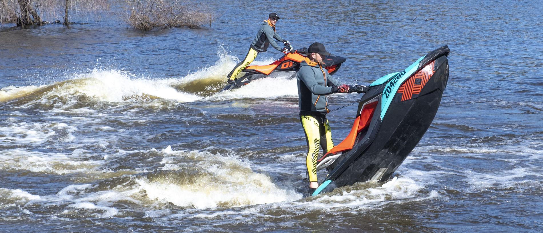 Jeremy Paton (front) and Beau Kenealy from Toowoomba MPE wheelstand their Sea-Doo watercraft at the Queensland Outdoor Adventure Expo, Toowoomba Showgrounds. Friday, July 29, 2022. Picture: Nev Madsen.