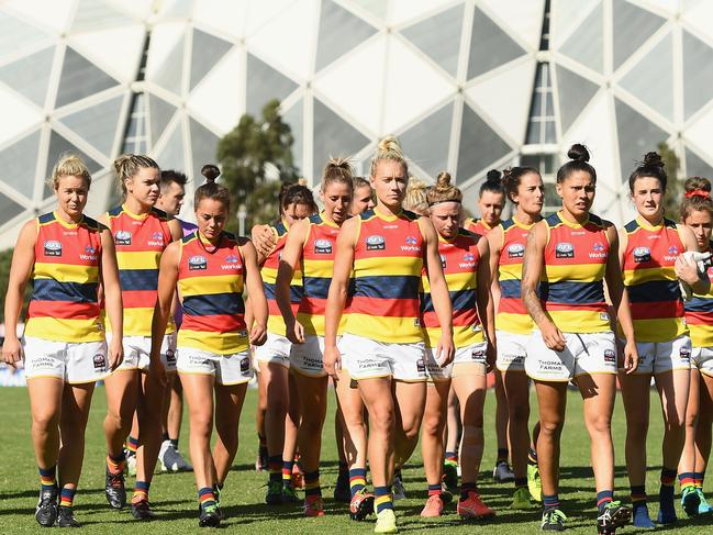 MELBOURNE, AUSTRALIA - MARCH 18:  The Crows look dejected after losing the round seven AFLW match between the Collingwood Magpies and the Adelaide Crows at Olympic Park on March 18, 2018 in Melbourne, Australia.  (Photo by Quinn Rooney/Getty Images)