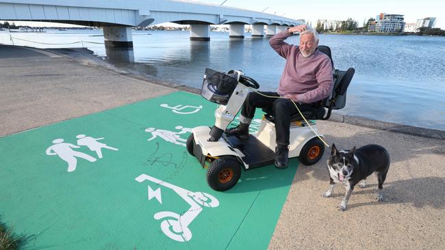 Peter Sprague and Sally the dog wonder what it all means for them. Picture: Glenn Hampson.