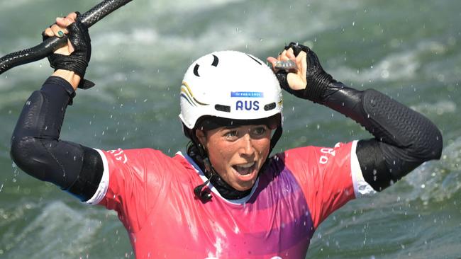 Australia's Noemie Fox celebrates winning in the women's kayak cross final of the canoe slalom. Picture: Bertand Guay / AFP