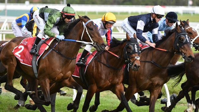 Brett Prebble on Incentivise (no. 2) works up out wide in the run to the first turn. Picture: Vince Caligiuri – Getty Images