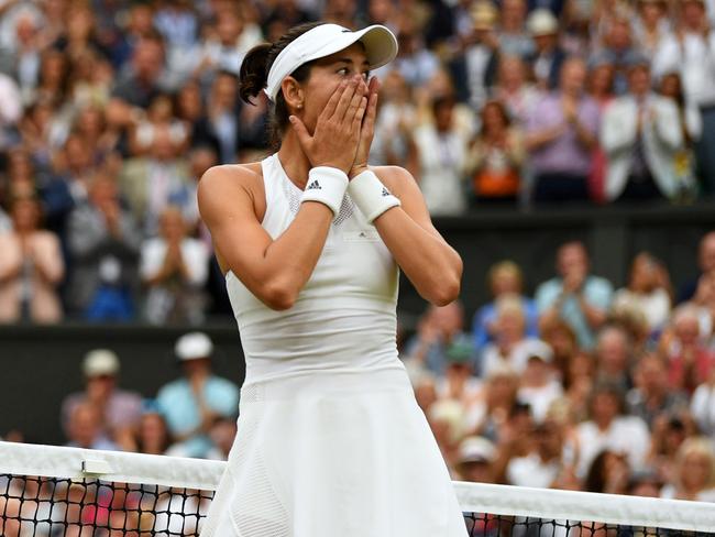 LONDON, ENGLAND - JULY 15:  Garbine Muguruza of Spain celebrates victory after the Ladies Singles final against Venus Williams of The United States on day twelve of the Wimbledon Lawn Tennis Championships at the All England Lawn Tennis and Croquet Club at Wimbledon on July 15, 2017 in London, England.  (Photo by David Ramos/Getty Images)