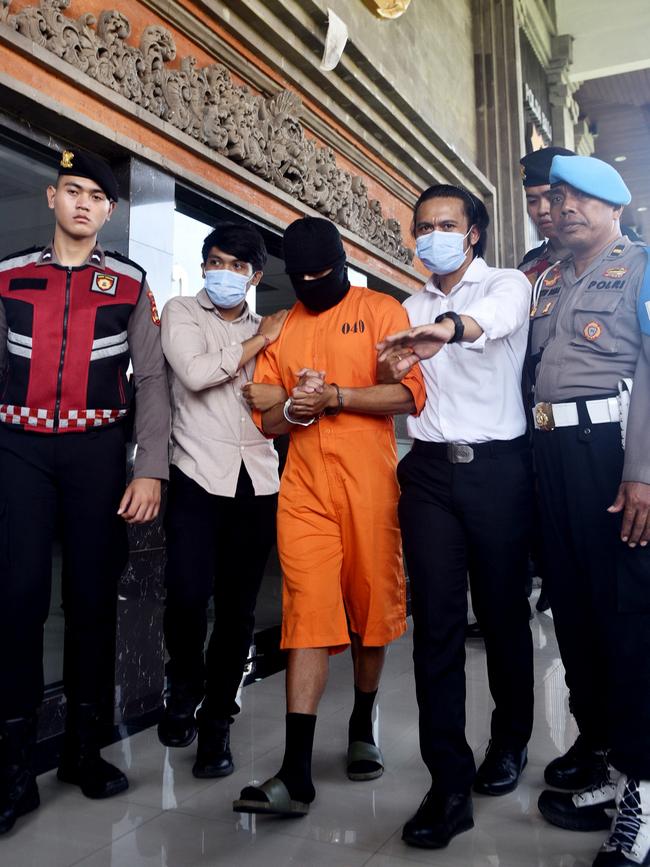 Lamar Aaron Ahchee is pictured being escorted by Bali Police on Monday. Picture: Lukman S. Bintoro