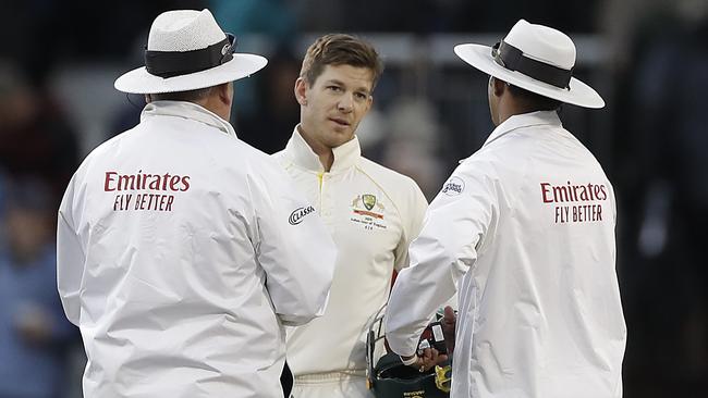 Tim Paine talks to the umpires late on day three. Picture: Getty Images