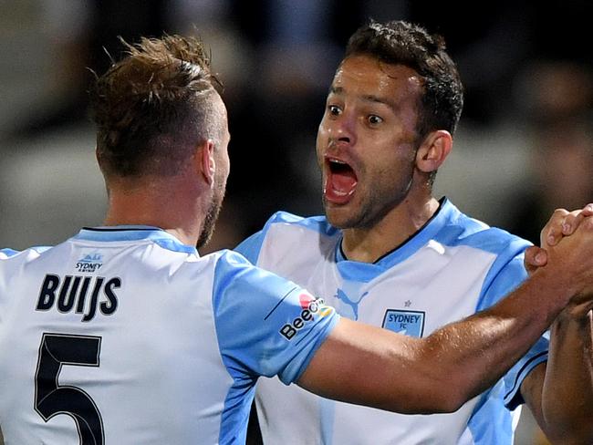 Bobo of Sydney (R) is congratulated by team-mate Jordy Buijs (L) after he scored a goal during the FFA cup semi final match between South Melbourne FC and Sydney FC, at Lakeside stadium in Melbourne, Wednesday, October 11, 2017. (AAP Image/Joe Castro) NO ARCHIVING, EDITORIAL USE ONLY
