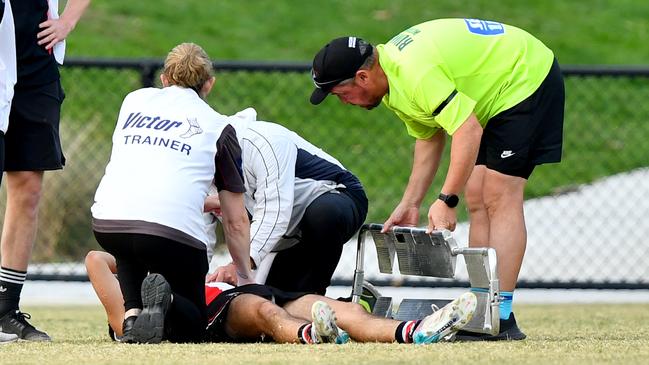 Watsonia’s James Charbel receives medical treatment. Picture: Josh Chadwick