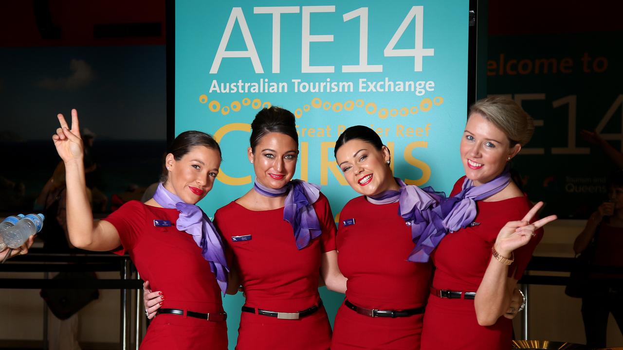 2014 Australian Tourism Exchange (ATE14). Virgin Australia Girle Tal Graham, Bec Marascelli, amelia Clarke and Lauren Clarke greet the thousands of delegates as they arrive at the Cairns Convention Centre. Picture: Stewart McLean.