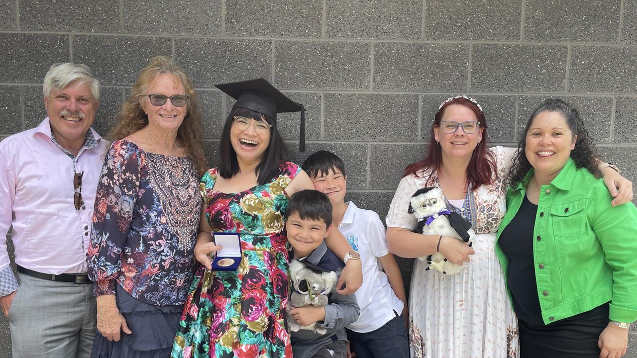 Ruth Duong (centre) celebrates at the University of the Sunshine Coast graduation ceremony.