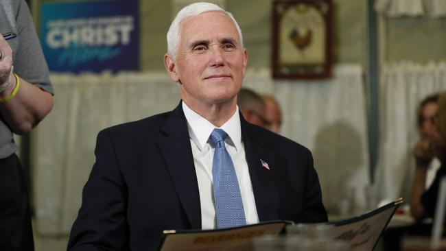 Mike Pence waits to order at restaurant in Forest City, Iowa, on Wednesday (AEST). Picture: AP