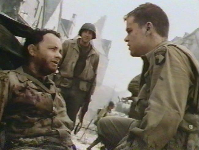 Actor Tom Hanks (l) with Matt Damon in scene from film 