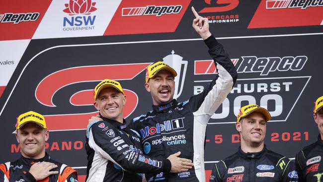 Lee Holdsworth and Chaz Mostert celebrating on the podium after winning the Repco Bathurst 1000 at Mount Panorama in 2021. Picture: Tim Hunter.