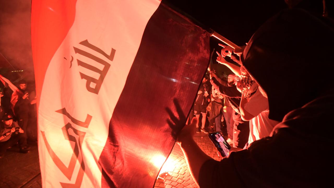 Many carried flags and had their faces covered. Picture: NCA NewsWire / Jeremy Piper