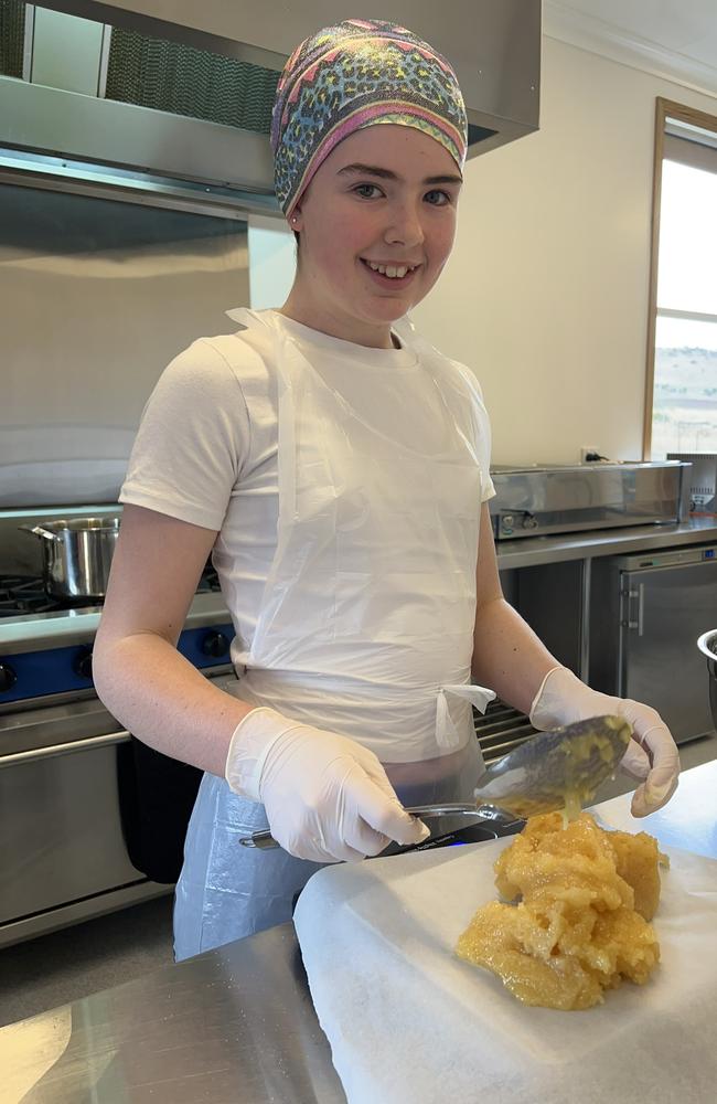 Richmond teen Audrey Long, 13, is the driving force behind Hive &amp; Cob leatherwood popcorn. Picture: Supplied/ Coolgardie Farm