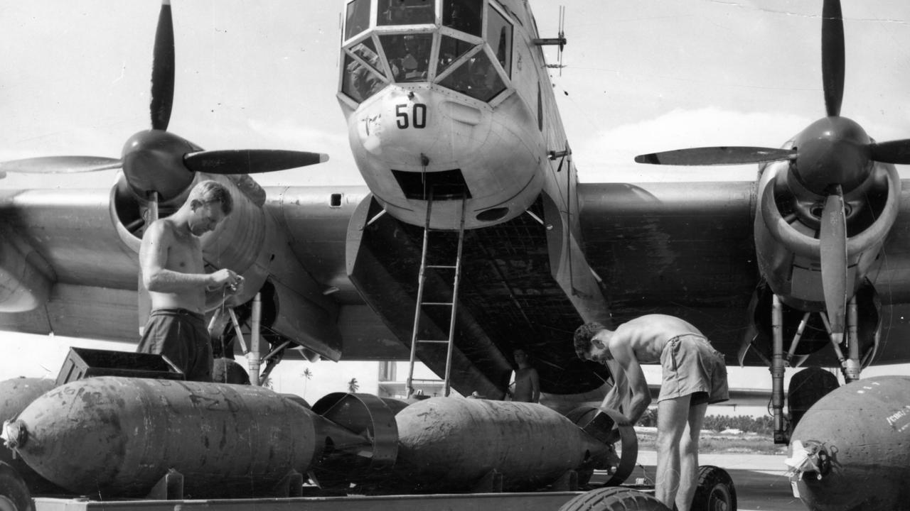 RAAF armourers loading 1000 pound bombs into Lincoln aircraft at RAAF Air Base, Butterworth, Penang. Leading Aircraftman John Kemp of Floreat Park, Perth, and Leading Aircraftman David Hislop, of Lenah Valley, Hobart, Aug 1957. Picture: RAAF