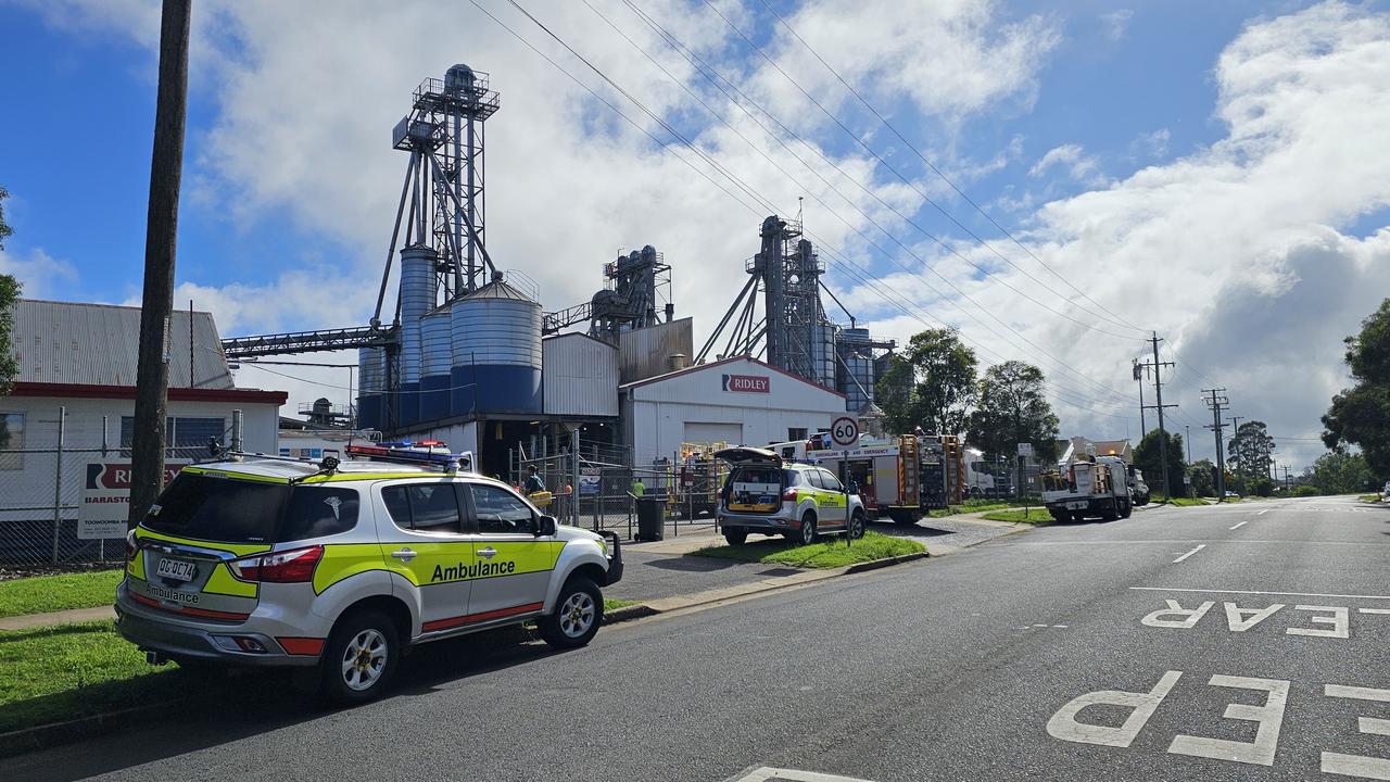 Two men have been taken to hospital after a fire at an industrial site on Anzac Avenue in Harristown.