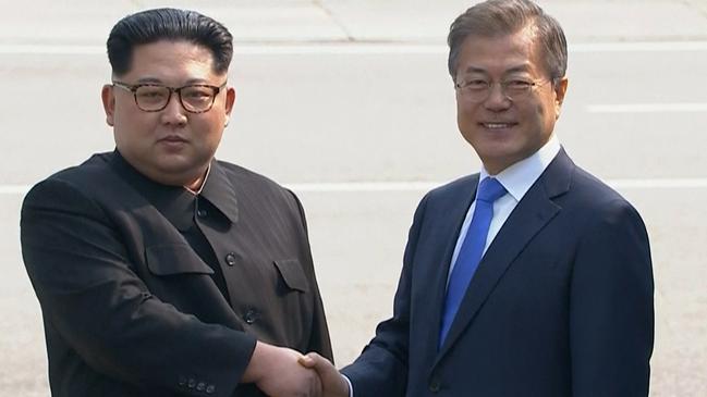 Kim Jong Un shakes hands with Moon Jae-in. Picture: AP.