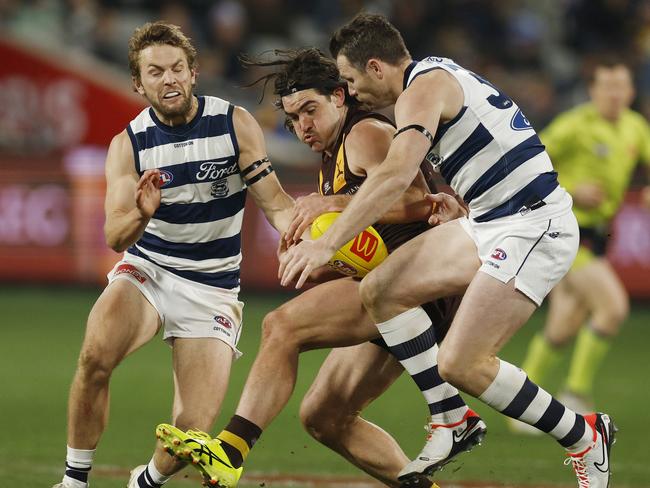 Jai Newcombe and Patrick Dangerfield collide. Picture: Michael Klein