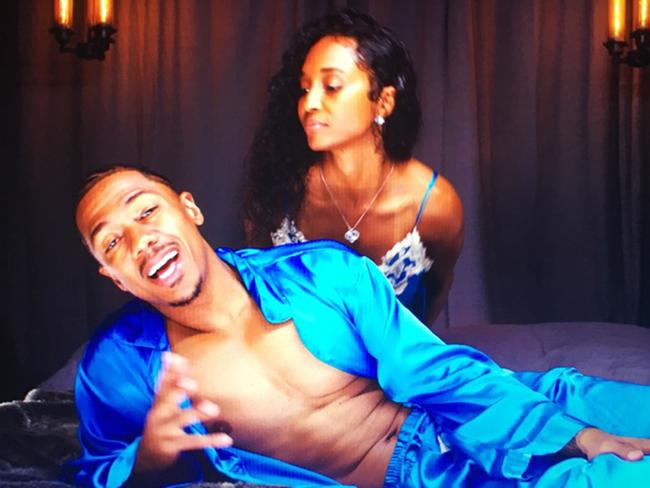 Nick Cannon and reported new girlfriend Rozanda 'Chilli' Thomas get in bed together for the star's new music video. Picture: Splash