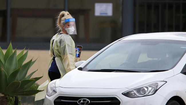 Staff wearing PPE at the St Basils nursing home in Fawkner. Picture: Aaron Francis.