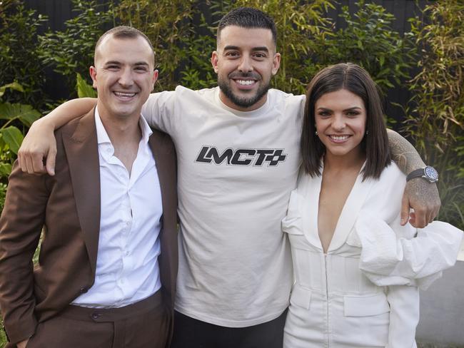 *EMBARGOED UNTIL 9PM SUNDAY 5/11/23 *Contestants Steph and Gian at The Block 2023 auctions at Hampton East. Also pictured: host Scott Cam and buyer of their home Adrian Portelli. Picture: Supplied/Channel 9