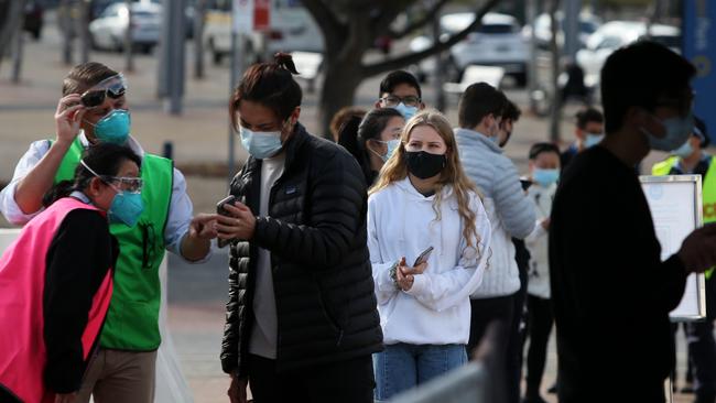 Year 12 students rush to vaccination hubs in Sydney on Monday. Picture: Getty Images