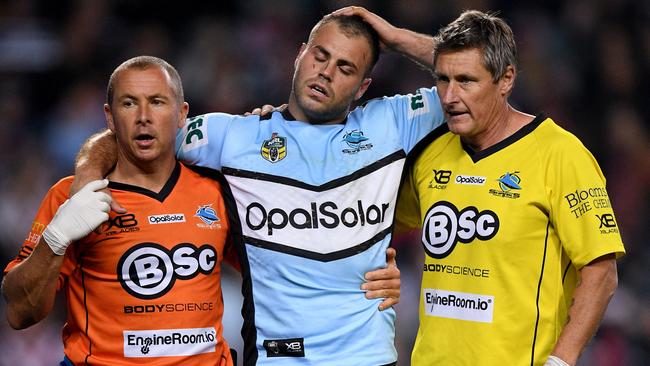 Wade Graham of the Sharks is assisted from the field by trainers after injuring his knee during the Qualifying Final between the Sydney Roosters and the Cronulla-Sutherland Sharks in Week 1 of the NRL Finals Series at Allianz Stadium in Sydney, Saturday, September 8, 2018. (AAP Image/Dan Himbrechts) NO ARCHIVING, EDITORIAL USE ONLY