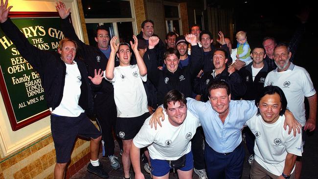 Manly Savers Rugby players having a get together with publican and sponsor Ross Ryan (blue shirt) before a grand final in September 2004. Picture: Virginia Young