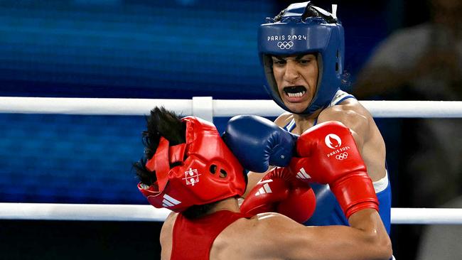 Algeria's Imane Khelif (Blue) competes at the Paris 2024 Olympic Games. (Photo by Mauro PIMENTEL / AFP)