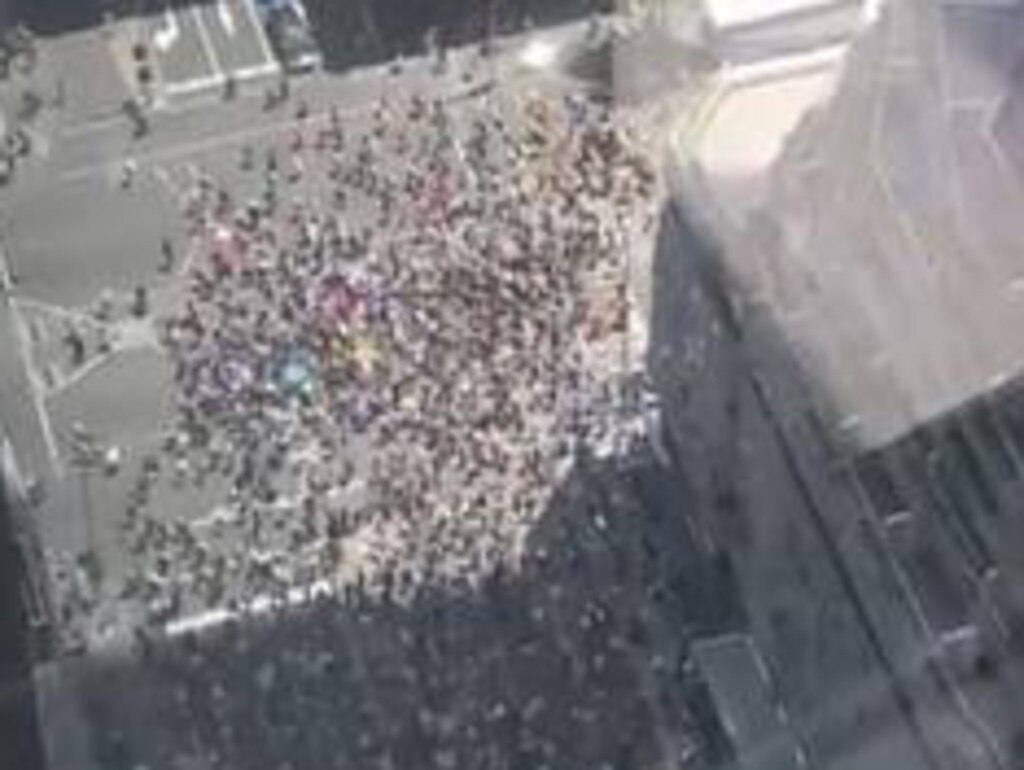 James Newburrie took this photo of the protest taking place in Melbourne from his apartment. Picture: @DifficultNerd