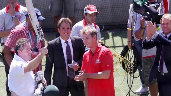 Shane Warne claps Piers Morgan after he faced Brett Lee.