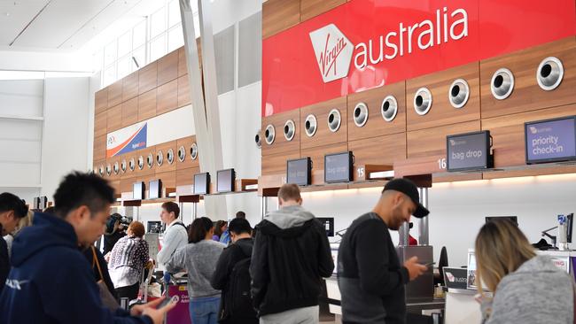 Waiting game: A queue at the Virgin Australia check in area in Adelaide. Picture: AAP/Morgan Sette