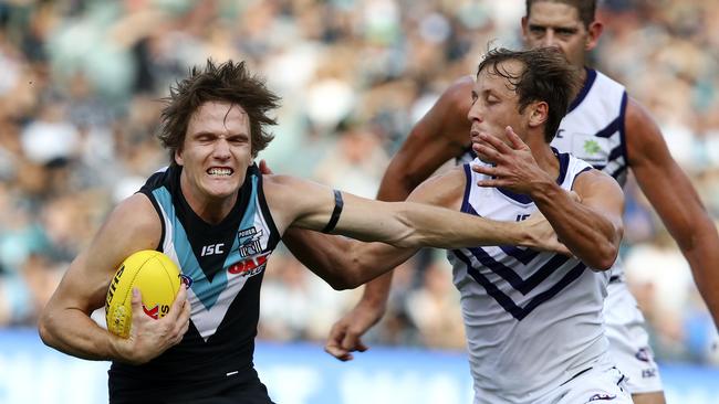 Jared Polec evades Freo’s Cameron Sutcliffe. Picture Sarah Reed