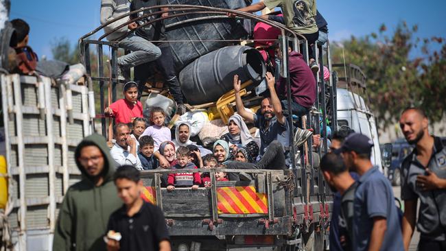 Displaced Palestinians flee Rafah with their belongings to safer areas in the southern Gaza Strip on Tuesday. Picture: AFP