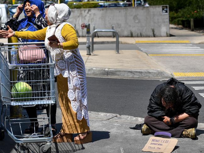 Homeless man Chris asks for donations outside Dandenong Market. Picture: Penny Stephens