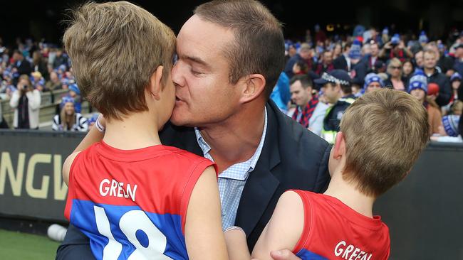 Brad embraces his son Wilba and Oliver. Picture: Michael Klein