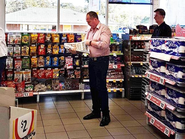 Barnaby Joyce reads the Daily Telegraph in a service station on Saturday morning. Picture: Supplied