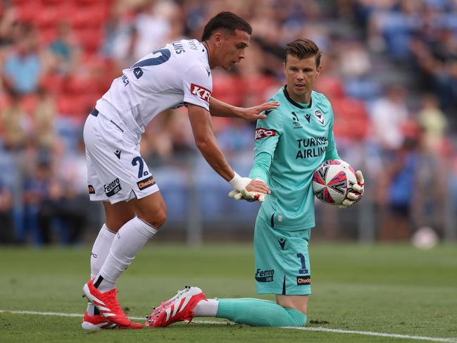Joshua Rawlins of Melbourne Victory congratulates Mitch Langerak of the Melbourne Victory on a save during the round 18 A-League Men match between Newcastle Jets and Melbourne Victory at McDonald Jones Stadium, on February 08, 2025, in Newcastle, Australia. (Photo by Scott Gardiner/Getty Images)