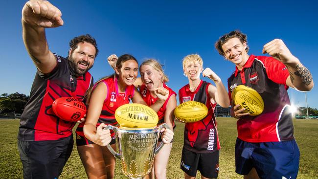 Burleigh Bombers will be a club benefiting from AFL players donating their Grand Finals tickets to community clubs. Burleigh Bombers Junior President Nick Mallen, Josie McCabe, 15, Piper Stockell, 15, Liam Mallen, 13 and Junior girls coach Sam Schlaghecke are excited about the prospect of getting Grand Final tickets. Picture: NIGEL HALLETT