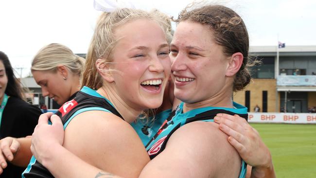 Yasmin Duursma and Abbey Dowrick embrace after the club’s first win. Picture: Sarah Reed/AFL Photos via Getty Images